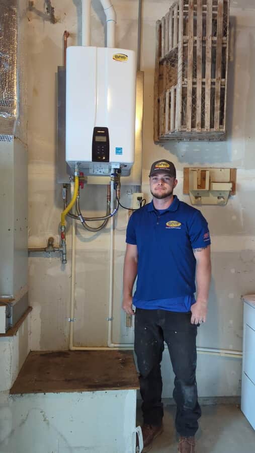 employee next to HVAC unit