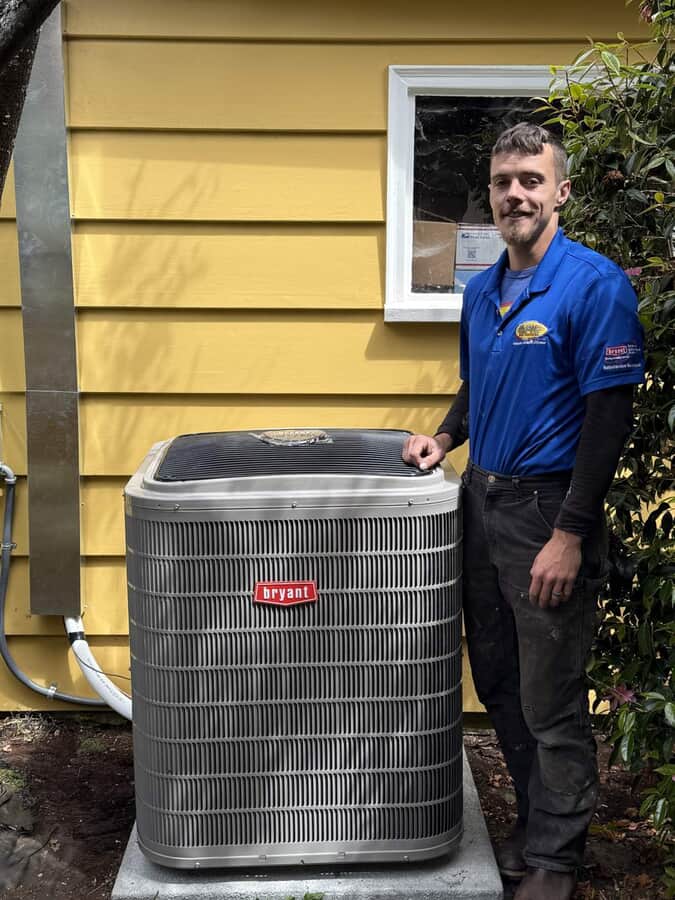 employee next to HVAC unit